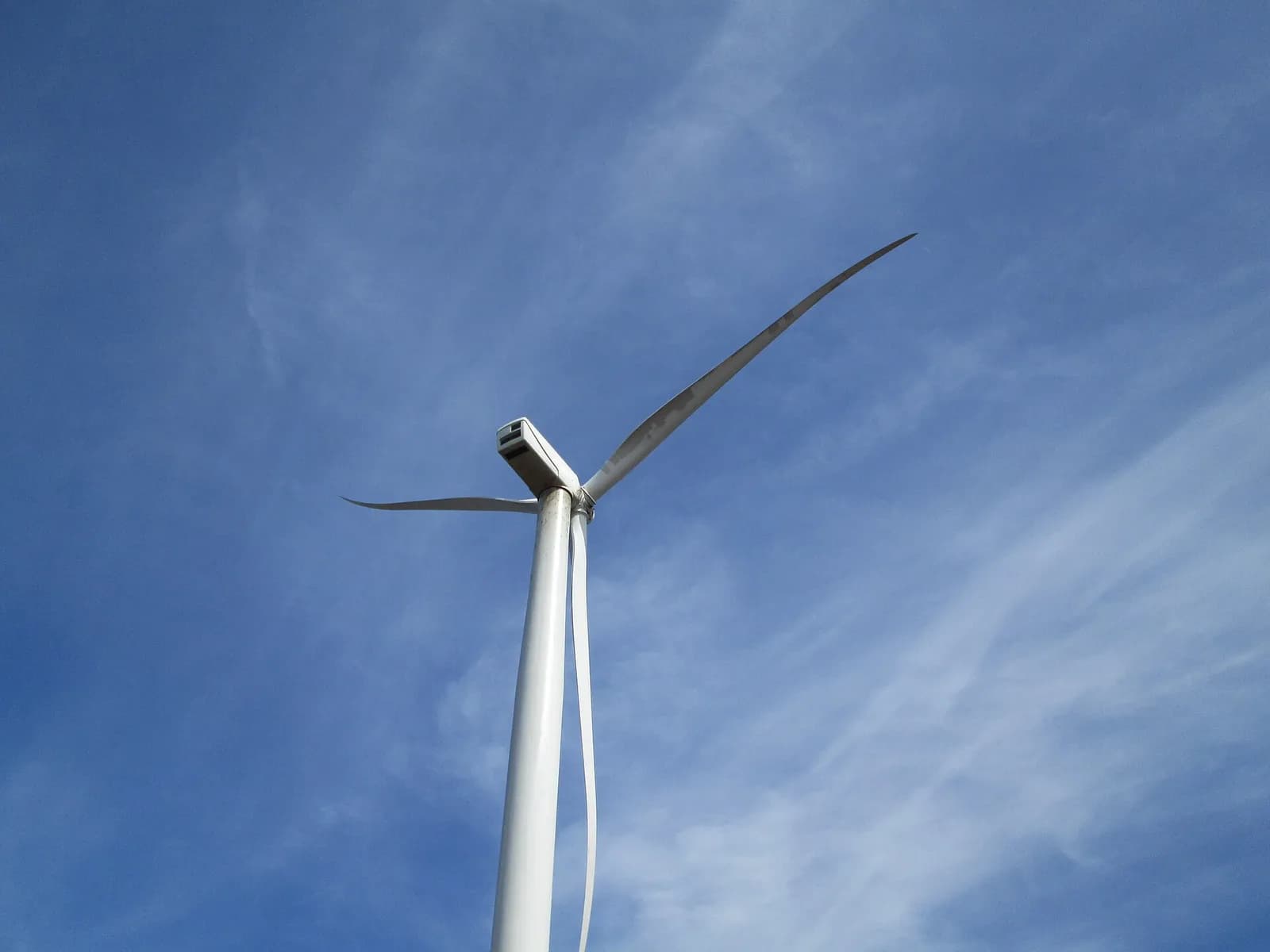 Photograph of a wind turbine against a blue sky at North Cape, Prince Edward Island